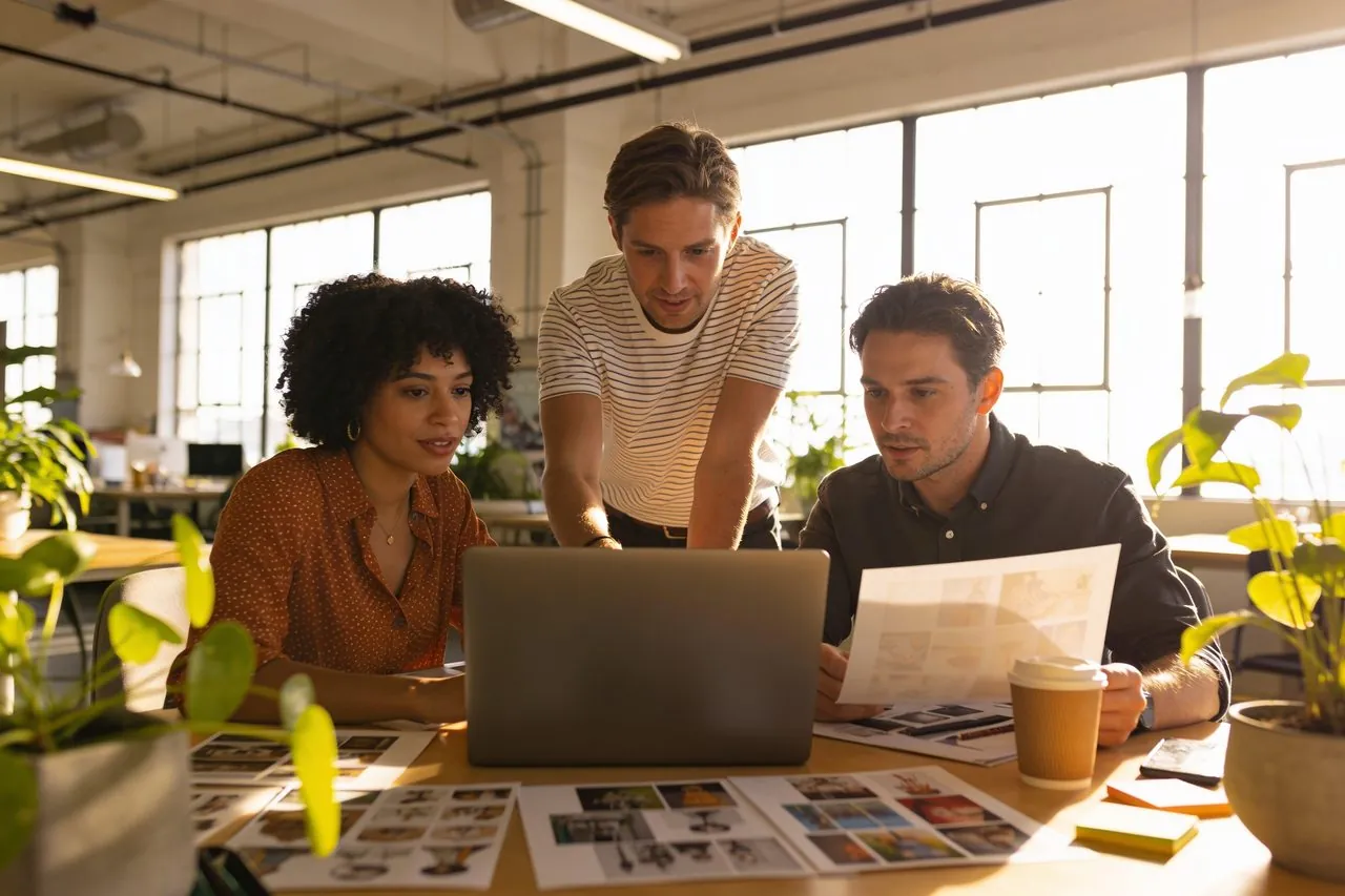 Small business owner planning content on a laptop