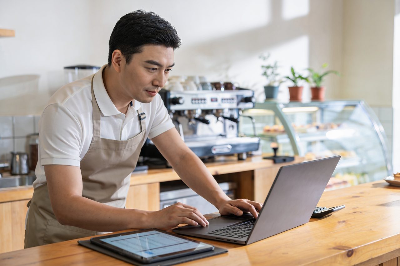 Small-business owner reviewing funding options at a desk