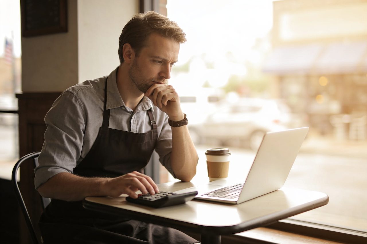 Small business owner building a cash flow forecast