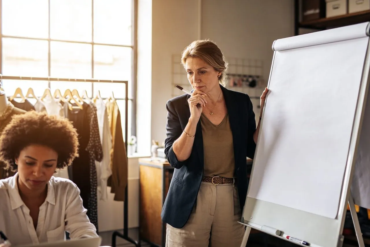 Small business owner reviewing break-even numbers